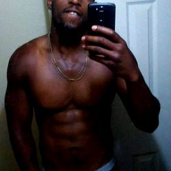 Fit and Ripped Model Showcasing His Abs