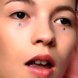 A young woman with expressive eyes,