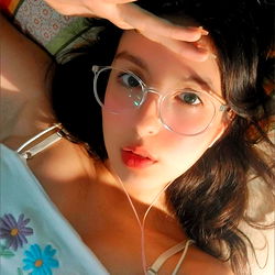 GODDESS MOON in a cozy bed, posing for the camera with an air of relaxed confidence. 🌙