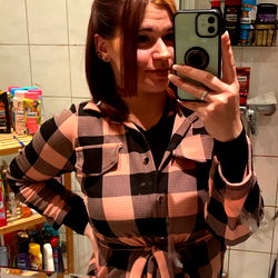 Woman with Short Hair Posing in Bathroom Mirror