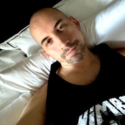 Rojeo, A Tattooed Man in a Casual Shirt