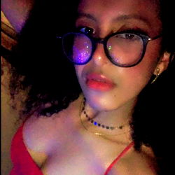 Young Adult Woman in Red Dress with Glasses, Age 25