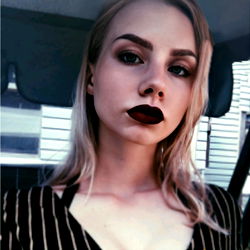 Russian Model's Seductive Stare in Rustic Setting