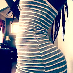 Sleek and Curvy Model in Striped Fashion Dress