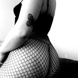 Mia Morales in a Fishnet Bodysuit