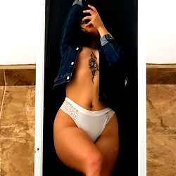 Fashionable Fitness Model Striking a Pose in Intimate Setting