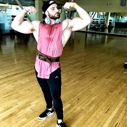 Muscular Gym-Goer Strikes a Powerful Pose in Workout Attire