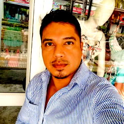 Man in front of a storefront